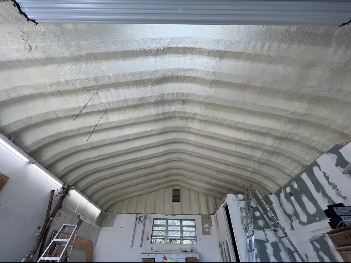 Spray polyurethane foam applied to the underside of a metal roof deck in Hernando