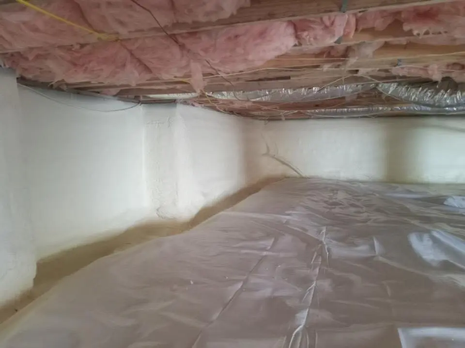 Crawl space encapsulation with closed-cell spray foam for Commercial Roof Restoration in Hernando